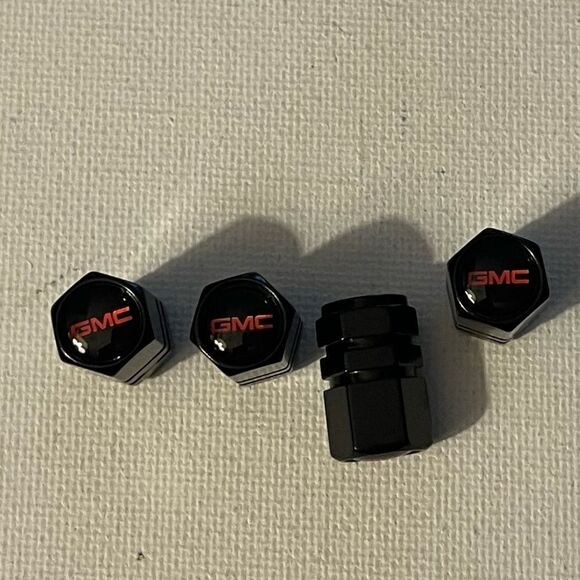 GMC Logo valve Stem caps in Black set of 4 NWT - Picture 1 of 4